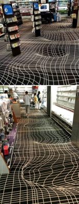 sixpenceee:    This optical illusion carpet, spotted in a Paris video game store provides an illusion of vortex floor.  