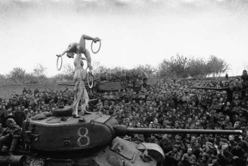 Acrobats perform for Russian troops during World War II.