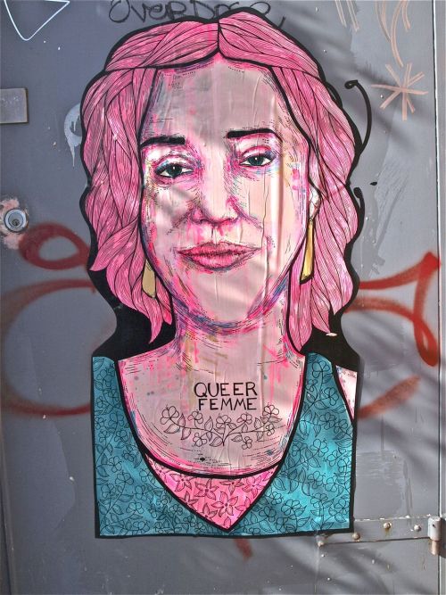 “Queer Love” pasted in Melbourne, Australia. Two portraits of a queer couple pasted side