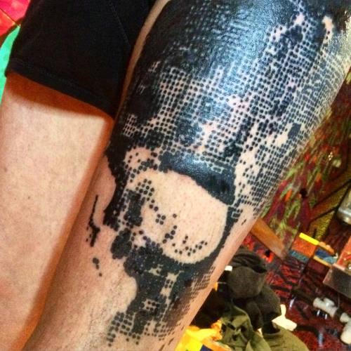 Here is a truly awful photo of the massive halftone skull I finished today. Half fresh half healed. 