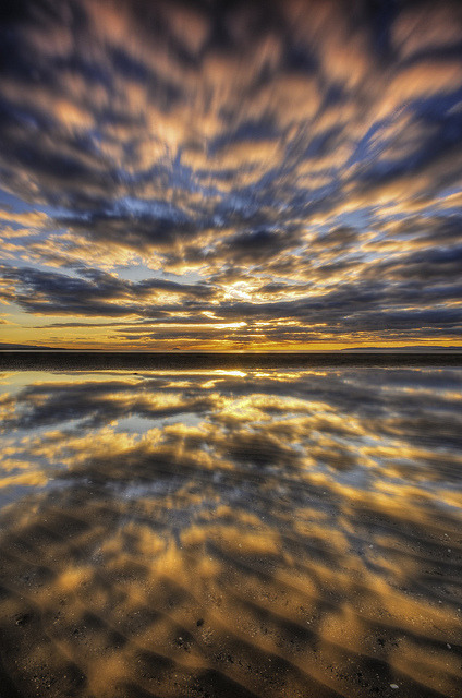 mistymorningme:  Troon Beach Sunset Reflections by MJSFerrier on Flickr.