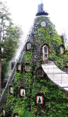 sixpenceee:  Hotel La Montana Magica, Huilo, ChileThe hotel is located in south chile, and made beautifully into the volcanic mountain with the fountain on top of it. (Source)For more posts, visit sixpenceee.com