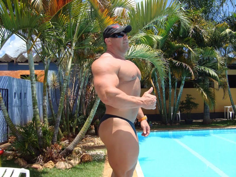 hotbodybuilders:  muscle-bear-corp:  bighugeguys:  Marcelo De Paula by the pool.