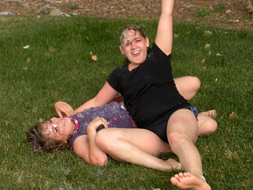 Neighbors fighti in the backyard victory pose