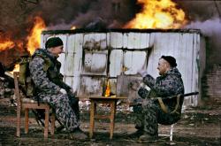 soldiers-of-war:  RUSSIA. Chechnya. Grozny. January 2000.  Fighters from the Russian militia special forces play a game in the destroyed city of Grozny.Photograph:  Yuri Kozyrev/NOOR    Funny how soldiers do the same things all over the world. It&rsquo;s