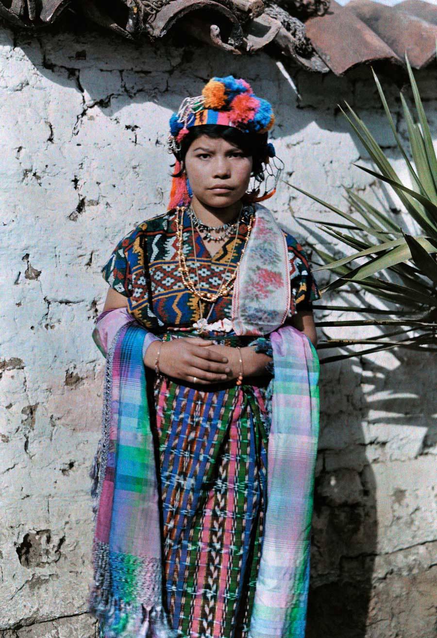 En dilletante - A young girl dressed in traditional clothing leans...