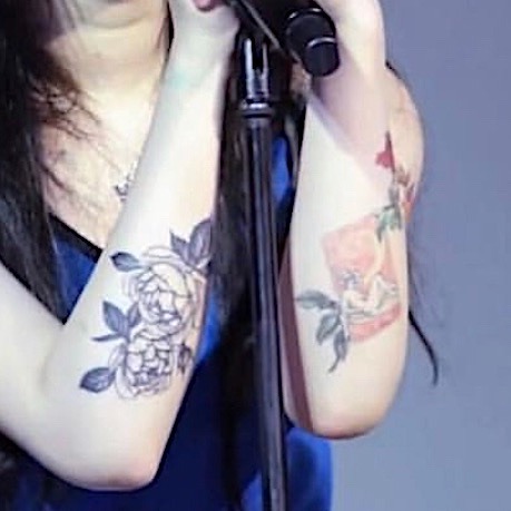 Her tattoos change again A female singer who showed off her tattoos in a  tubetop dress  KBIZoom