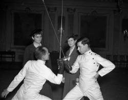 modernfencing:[ID: two men crossing foils as two women look on. Old, black and white photo.] A Star Tribune photo from 1937!