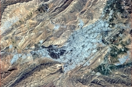 colchrishadfield:  Shiraz, Iran - A city of culture and technology. The colourful roof choices complement the landscape well.  O ja, Szyraz! 