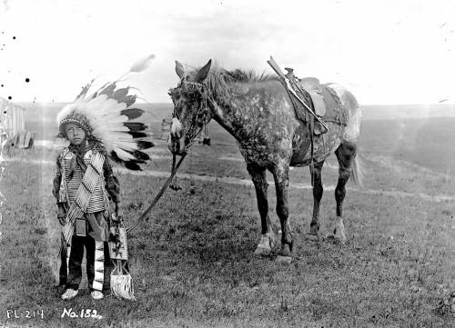 old-hopes-and-boots:A Lakota? boy. South Dakota. 1890s. Photo by Jesse H. Bratley. 