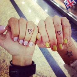 mildrose:  the tattoos and the nail color