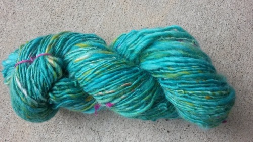 Left is Chintz by SpinJones fiber, spun thick and thin. Right is Rainbow Sherbert by To-Ply Fiber Ar