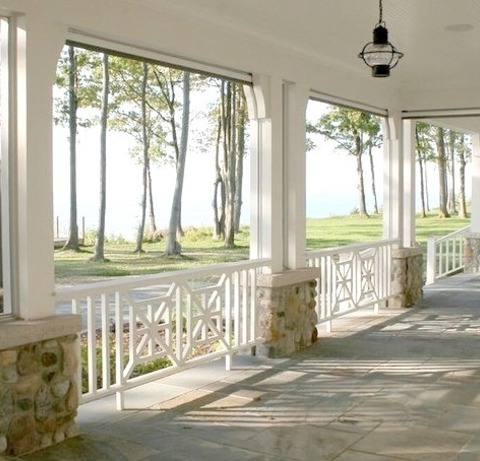 Chicago Traditional PorchLarge Classic Stone Front Porch Idea With A Roof Extension
