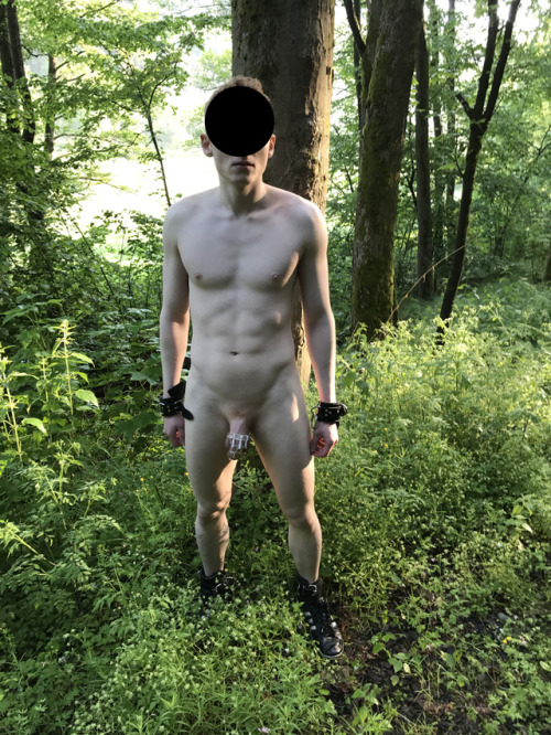 slave2megamaster4u:  These are some more pictures that were taken during another outdoor session with my Master a few weeks ago.My Master and I went into the woods, I had to strip down naked (down to my collar and my chastity cage) in the middle of the