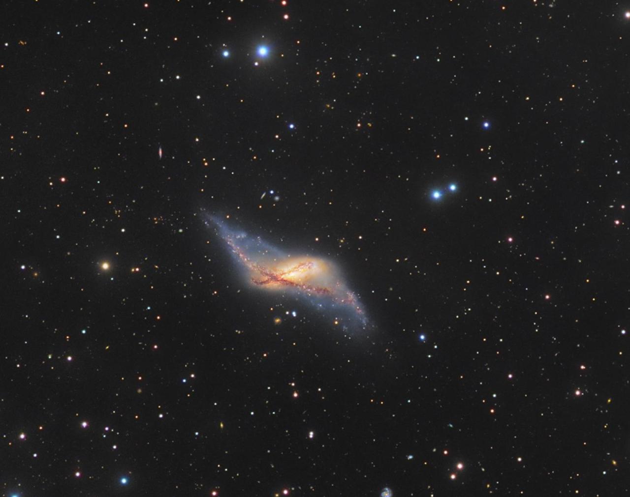 spaceexp:  NGC 660. A rare galaxy type, polar ring galaxies have a substantial population