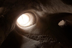sixpenceee:  Artist Ra Paulette and his dog have spent the last 10 years working in complete isolation from the outside world everyday, walking into New Mexico’s desert to work on a project. Paulette spends his days inside a sandstone cave that he