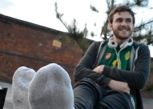 footlandia:  drakebois:Elliott | source: grahamh.co.ukA British lad becomes very reluctant when it came to taking his socks off, even saying “they’re properly blistered,” most likely because his friends are watching him through the pub window. In