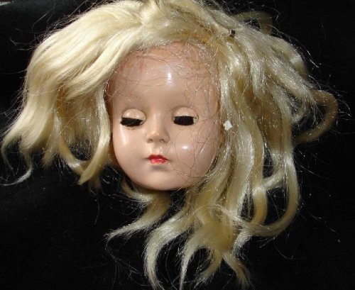 hazedolly:Hard plastic doll head, circa 1960s