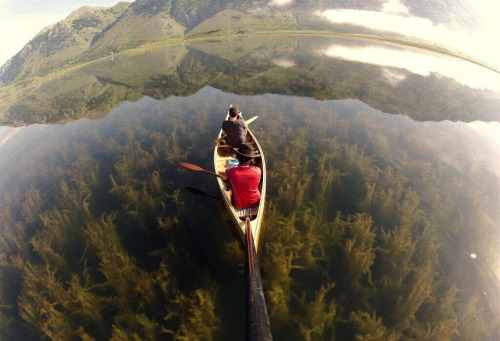 Canoeing in a crystal clear lake, Italy