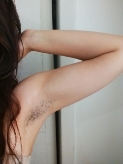 closet-hirsute:  I always feels slightly rebellious when I grow out my armpit hair, because for a while I am liberated from razor blades and comforted by my own fuzziness. Plus, FUCK BEAUTY STANDARDS. 