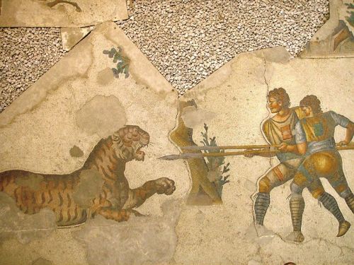 collectivehistory:A 5th-century mosaic in the Great Palace of Constantinople depicts two venatores f