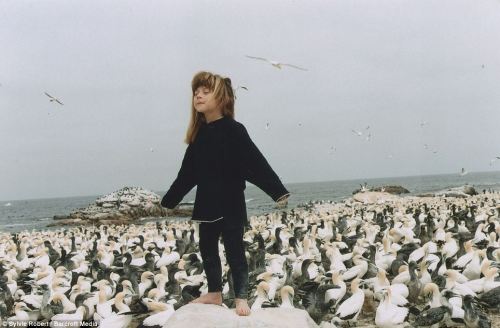 disdainme: At one with nature: Tippi aged 6 with her arms stretched out on Sea Bird Island, Africa.&