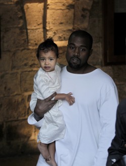 celebritiesofcolor:  Kanye West carries North