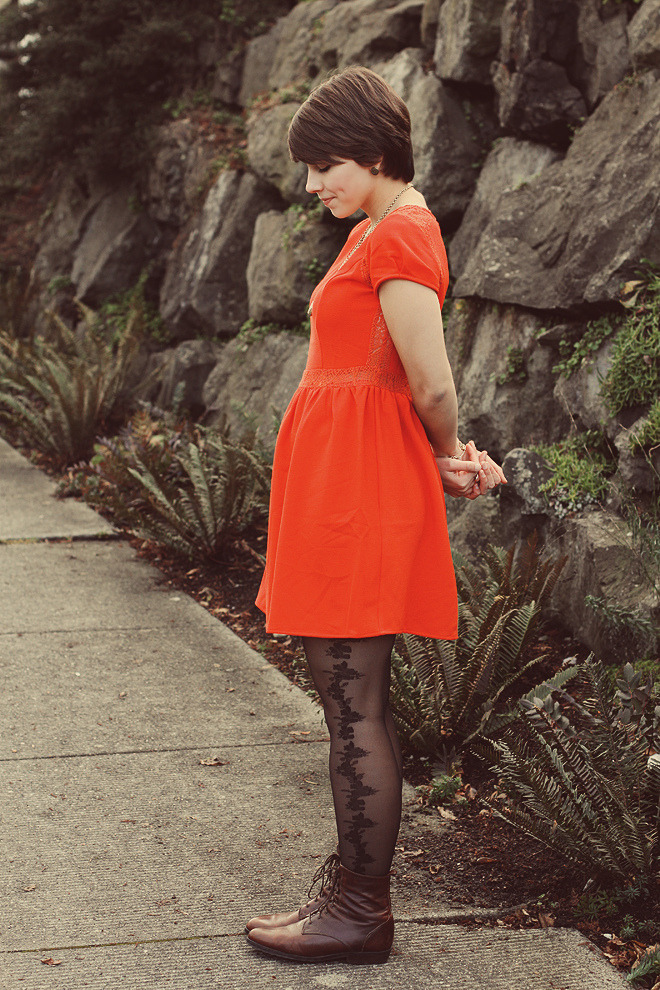 pantyhoseparty:  Bright red dress with black lace tights and cognac boots 