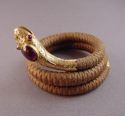 blondebrainpower:  Victorian antique snake coil bracelet with 14 karat yellow gold and garnets and a woven hair band, approximately 14&quot; total length by ½&quot; wide, snake head 2&quot; long. c.1880.