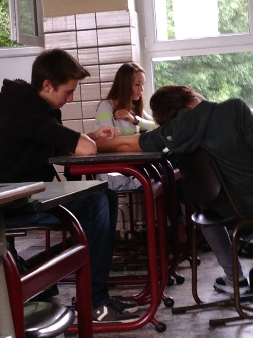 thedailylaughs:  psychoticpingouins:  There’s these two boys in my school who are always touching somehow. This morning they were holding hands in French class and here one is fondly stroking the other’s arm. When one of my best friend asked them