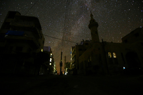 yahoonewsphotos: Starry nights and empty streets in Syria The stars fill the night sky over the eeri