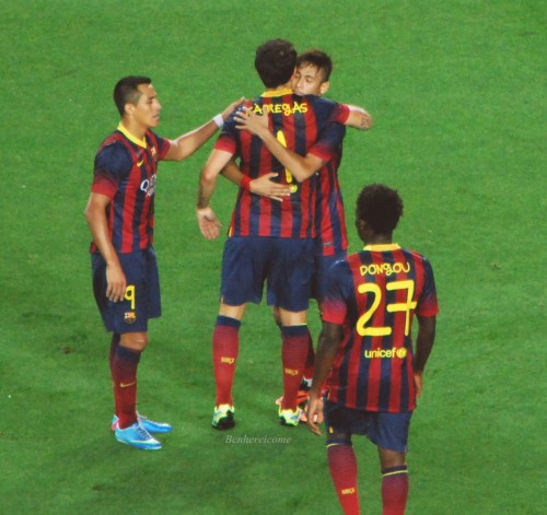 Neymar Jr. and Cesc Fabregas embracing after Cesc scored a beautiful goal with the help from a Neyma