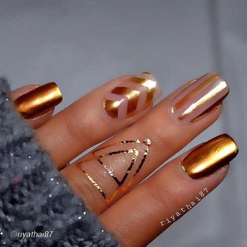 That&rsquo;s #hot! Love this #gold &amp; #Negativespace #manicure by @riyathai87! Diggin the