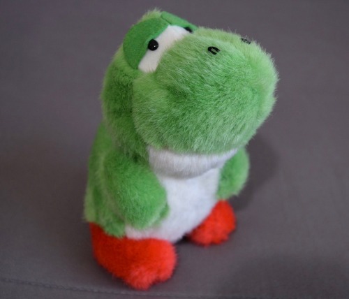 suppermariobroth:Rare officially licensed plush of the Baby Yoshi design seen in Super Mario World, 