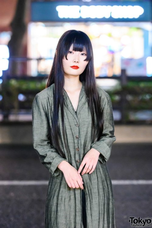 20-year-old Japanese student Kana on the street in Harajuku wearing a vintage linen maxi coat over a