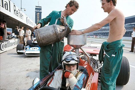 John Surtees’ Surtees-Cosworth TS7 is refuelled in the pits during a practice session, German Grand Prix, Hockenheim, 1970 © Schlegelmilch Collection / Getty Images