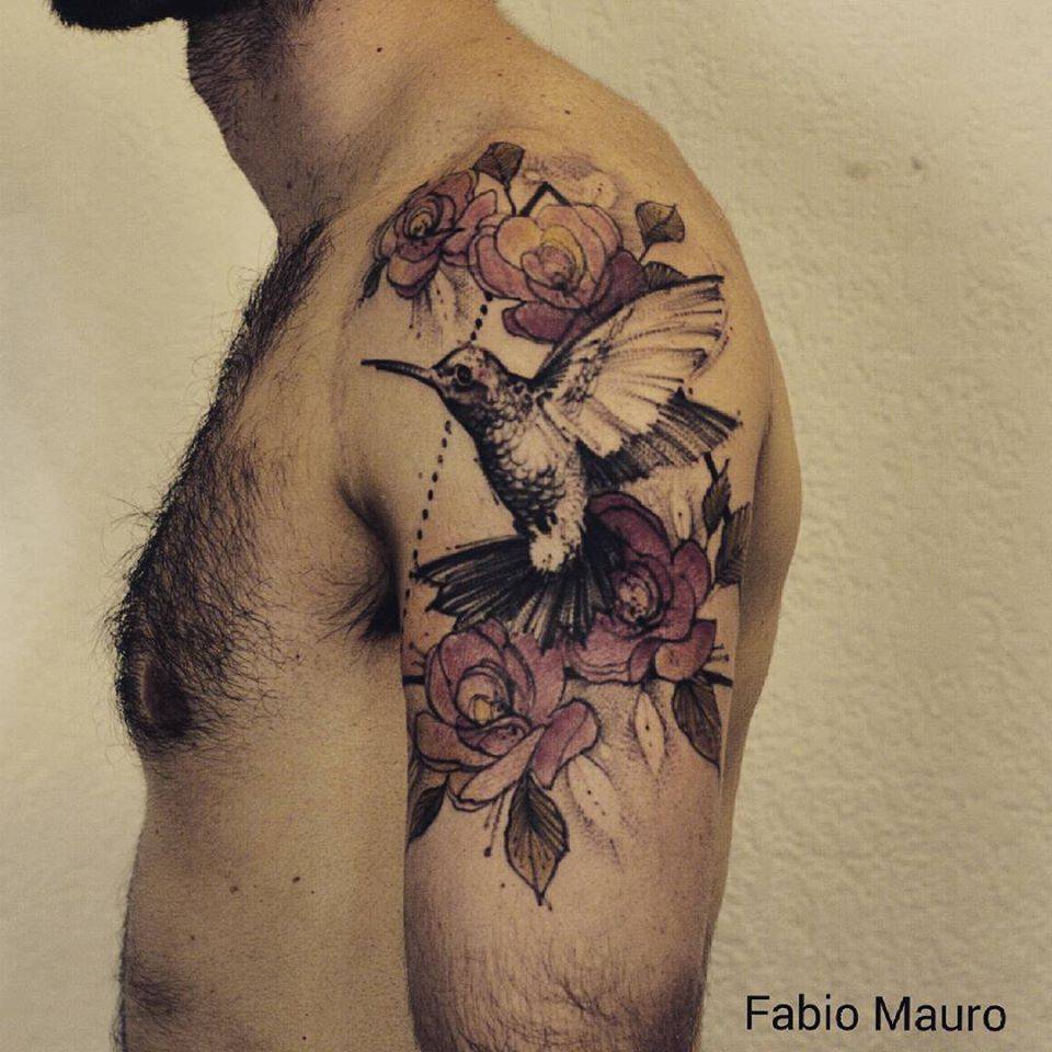 Sketchy red rose tattoo on the shoulder.