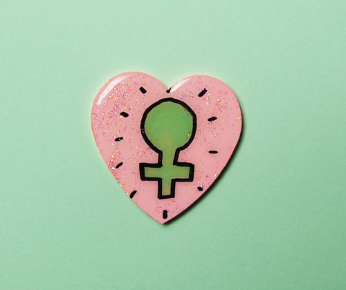 cryybabies:  pink FEMINIST venus symbol glitter heart brooch xo  Girl power! xo  