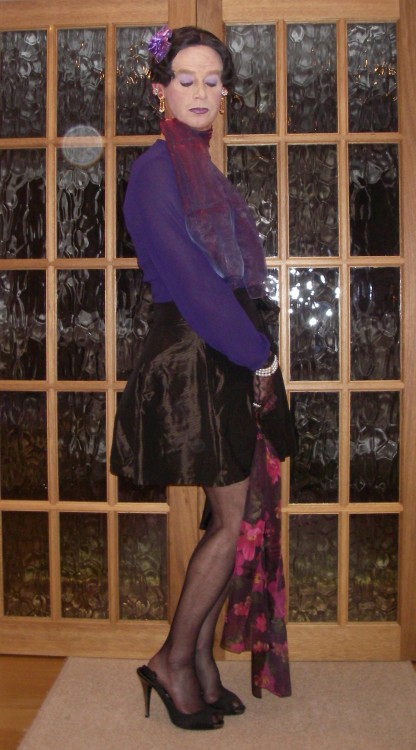 Purple chiffon blouse and satin mini-skirt. The skirt has a pretty bow on the waist. I love my chiff