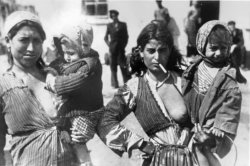 historicaltimes:  A look of defiance on the face of a French Gypsy  mother as she and another Gypsy woman are photographed with their children while interned at Camp de Rivesaltes . France, 1942. via reddit Keep reading