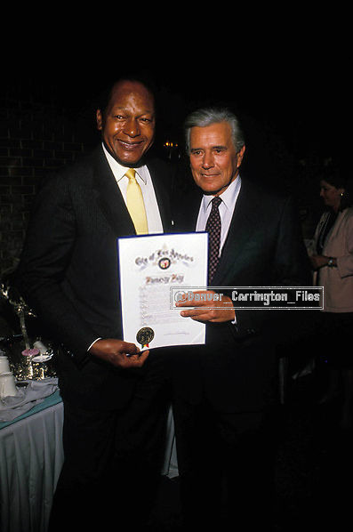 John with Los Angeles mayor Tom Bradley at the party to celebrate the show’s 200th episode on Decemb