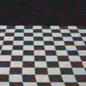 a set of three gifs showing a 3d scene with a rotating checkered floor and a picture of a light skinned woman in the corner of the images. floating above the floor, a shape is slowly built out of pink and black missing texture polygons. the shape slowly takes the shape of a human head. in the third gif, the head finishes rendering and a crude approximation of the woman in the photo replaces the missing texture.
