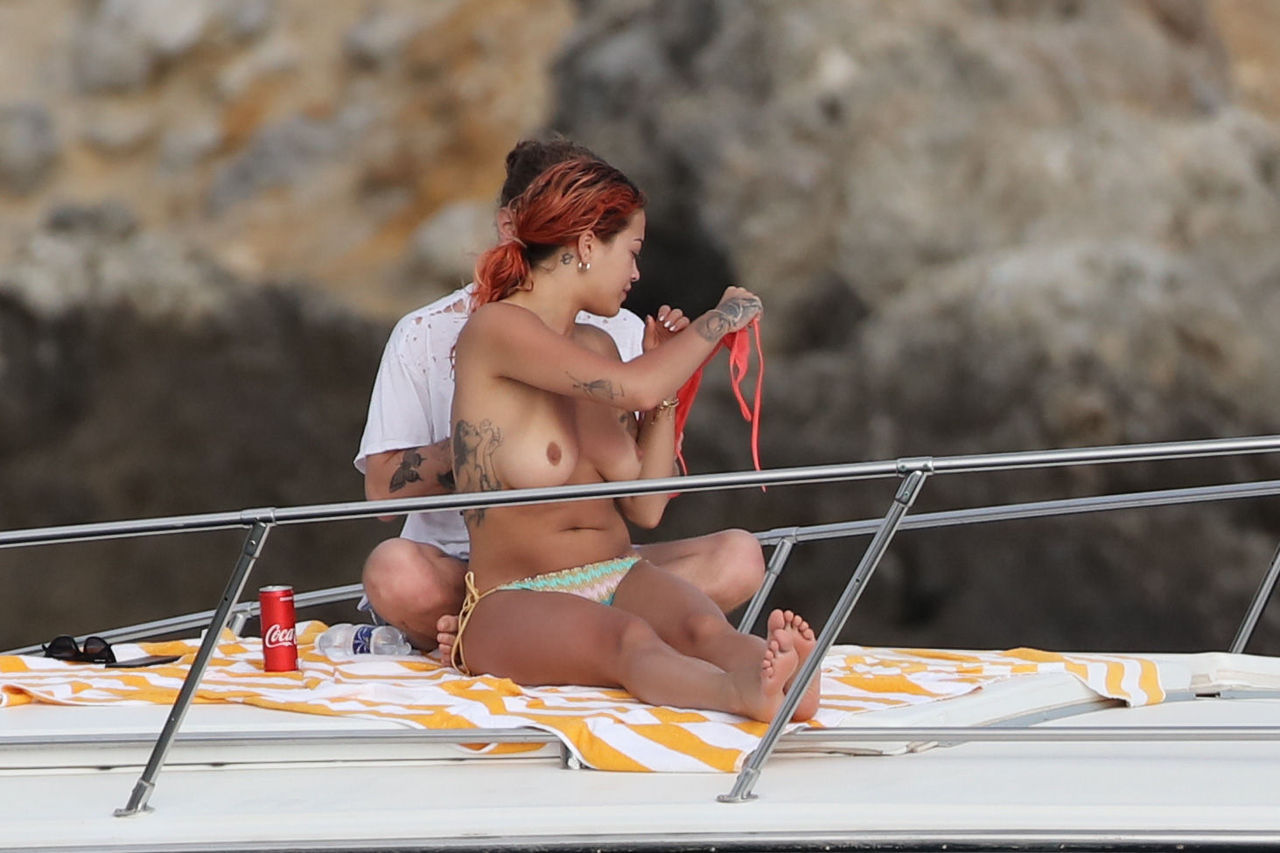 celebpaparazzi:  Rita Ora topless on vacationAccess ALL of Rita’s NUDE scenes &amp;