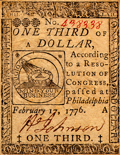 Continental currency in the amounts of $0.33 and $55, printed during the American Revolution. These 