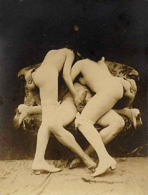 A man with two women; antique (early 20th c.). 