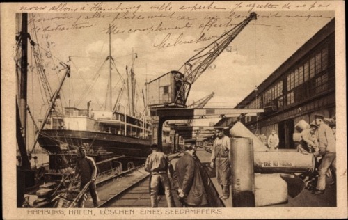 1912. Port of Hamburg; the loading of a steam ship.This photo was an old postcard up for sale on the