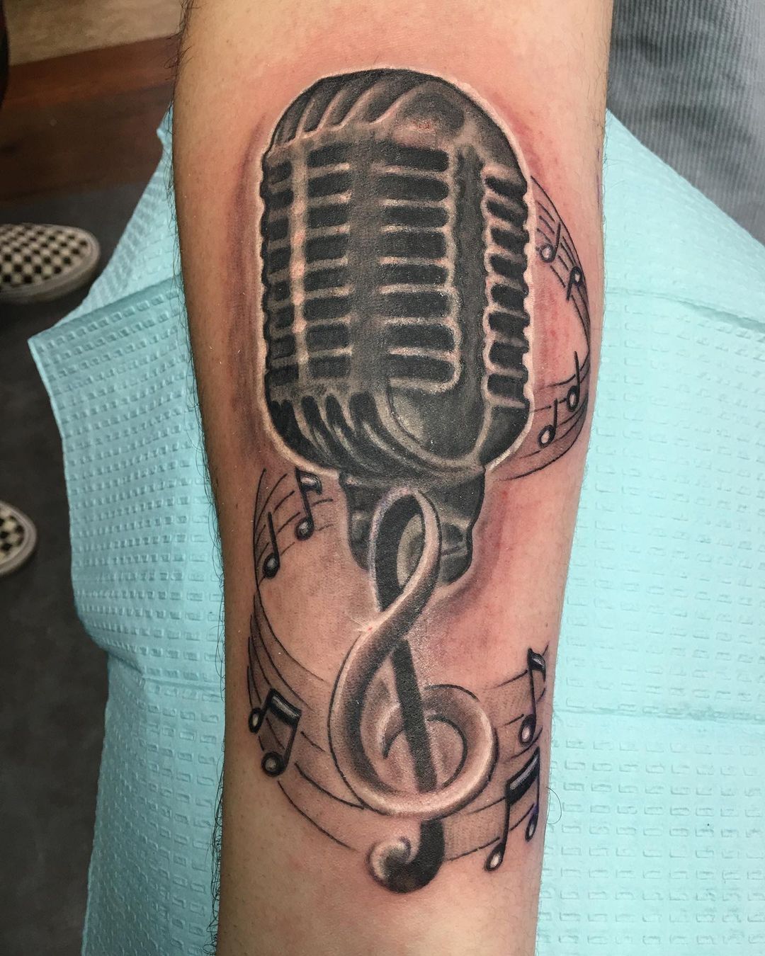 David Zobel Tattoo, Old school microphone with treble clef and music...