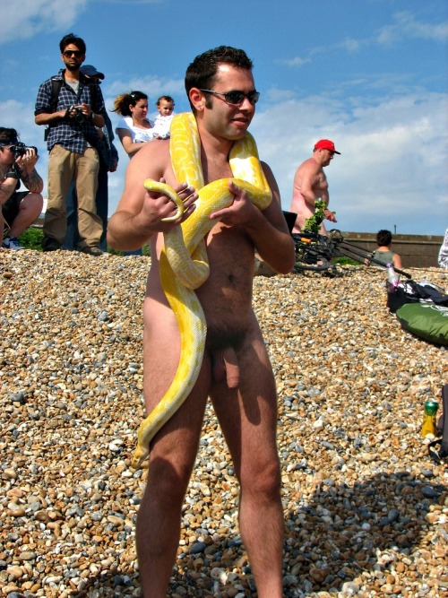 Man with huge yellow snake, WNBR (Brighton?).