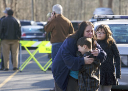 brob56:  mordaciouslyyours:  joshuadylan:  theatlantic:  At Least 27 Dead, Including Children, Killed in Connecticut School Shooting [Images: Michelle McLoughlin/Reuters; Shannon Hicks/The Newtown Bee]   Sources were saying it was three just fifteen