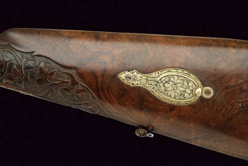 An engraved muzzleloading percussion shotgun originating from Brazil, mid 19th century.  Signed “TRO